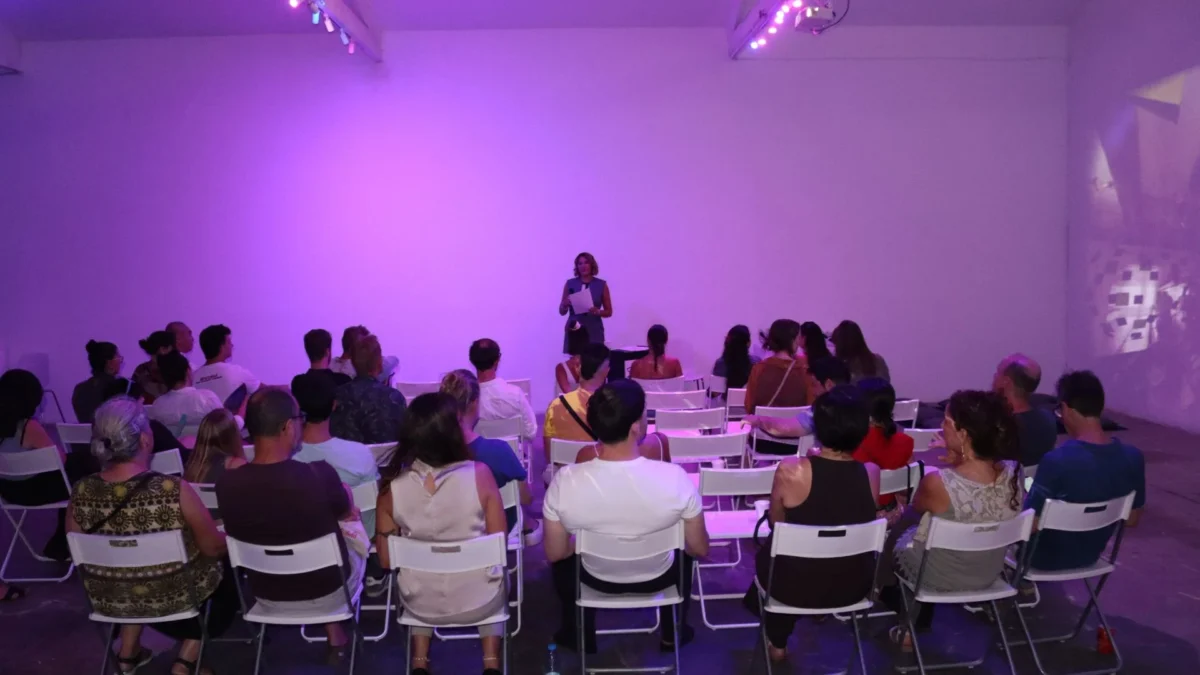 Nacoca Ko addressing the audience during the Spinning in Fluid Dreams Artist Talk