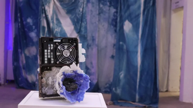 Sculpture by Nacoca Ko combining electronic components and blue resin, Spinning in Fluid Dreams